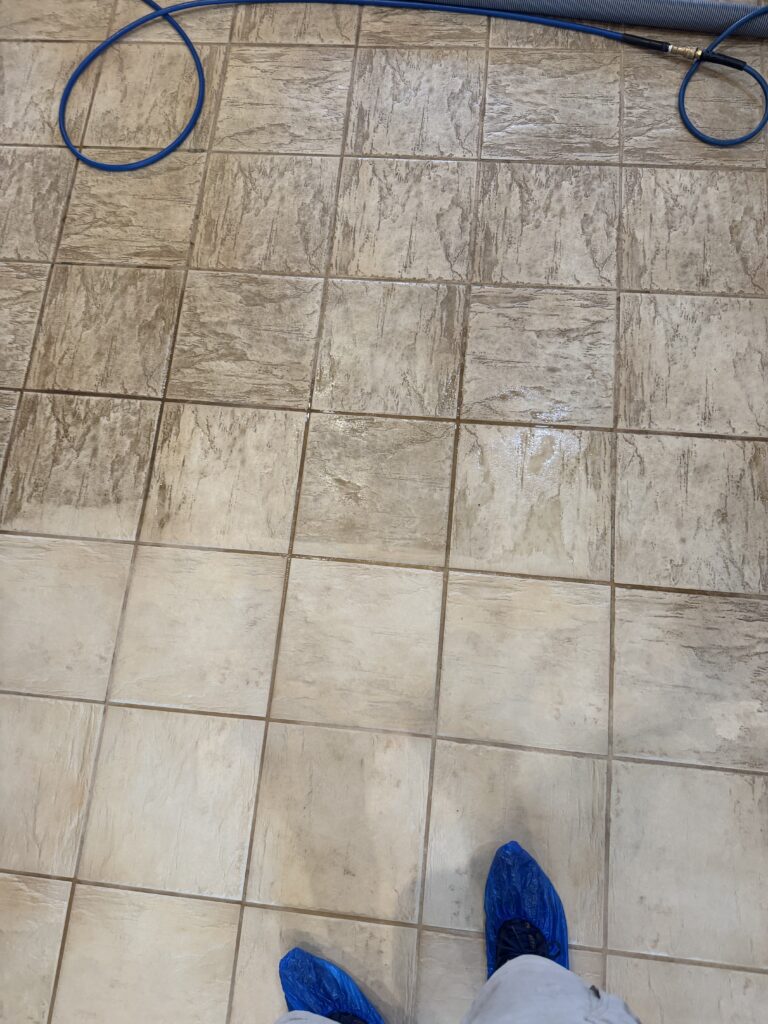 Grout before and after professional cleaning on an Austin-area tile floor
